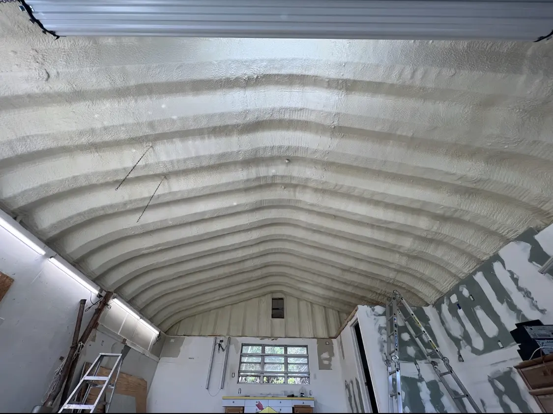 Spray polyurethane foam applied to the underside of a metal roof deck in Gages Lake